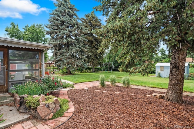 6755 W 45th Ave, Wheat Ridge, CO 80033 - view of grassy yard with a sunroom and an outdoor structure