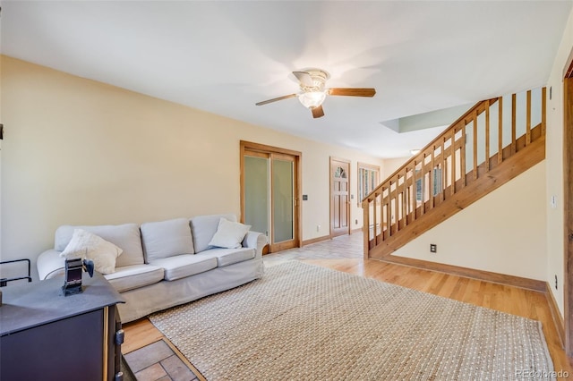 18247 State Highway 7, Lyons, CO 80540 - living room with ceiling fan, stairs, baseboards, and light wood-style flooring