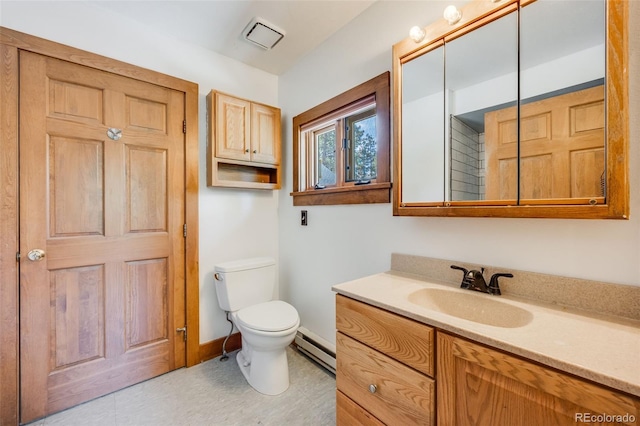 18247 State Highway 7, Lyons, CO 80540 - bathroom with baseboard heating, vanity, toilet, and baseboards