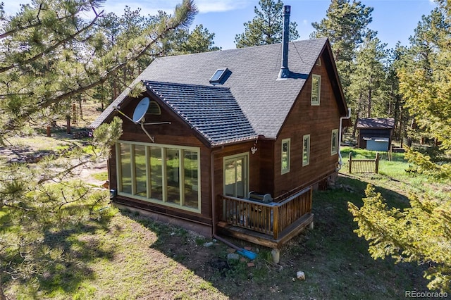 18247 State Highway 7, Lyons, CO 80540 - back of house with a shingled roof and a deck