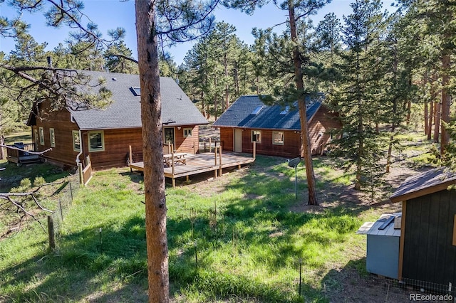 18247 State Highway 7, Lyons, CO 80540 - view of green lawn featuring a deck and an outbuilding