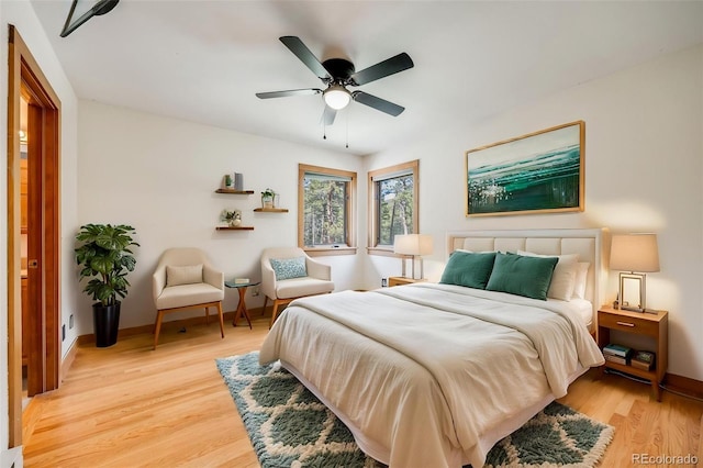 18247 State Highway 7, Lyons, CO 80540 - bedroom with light wood finished floors, baseboards, and a ceiling fan