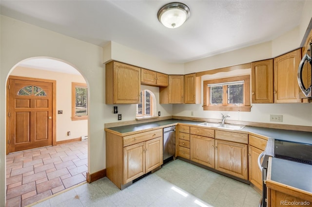 18247 State Highway 7, Lyons, CO 80540 - kitchen with electric stove, a sink, dishwasher, arched walkways, and baseboards