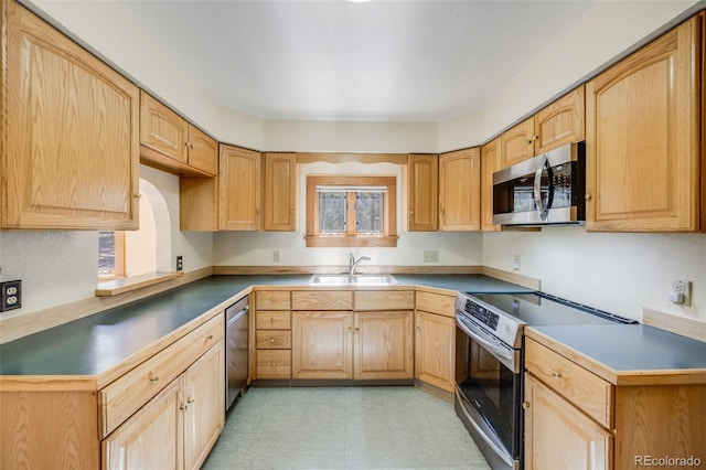18247 State Highway 7, Lyons, CO 80540 - kitchen featuring appliances with stainless steel finishes, a sink, light flooring, and light brown cabinets