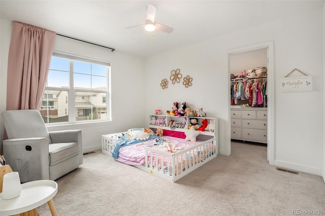 14818 Dahlia St, Thornton, CO 80602 - bedroom with a walk in closet, carpet, a ceiling fan, and a closet