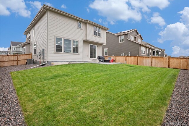 14818 Dahlia St, Thornton, CO 80602 - back of house featuring a fenced backyard and a patio area