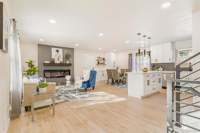 living room with light hardwood / wood-style flooring