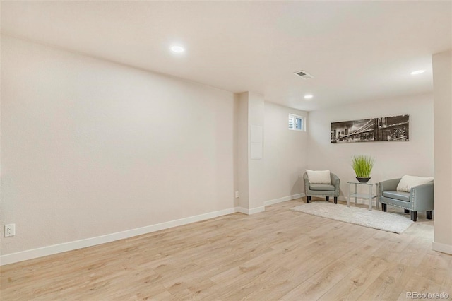 sitting room with light hardwood / wood-style flooring