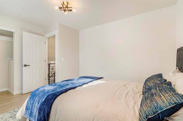 bedroom with hardwood / wood-style flooring