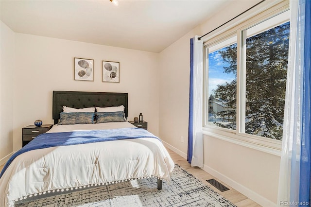 bedroom with light wood-type flooring