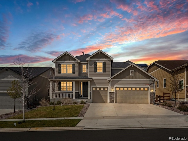 13041 Reata Ridge Dr, Parker, CO 80134 - craftsman-style house featuring covered porch, stone siding, board and batten siding, a lawn, and driveway