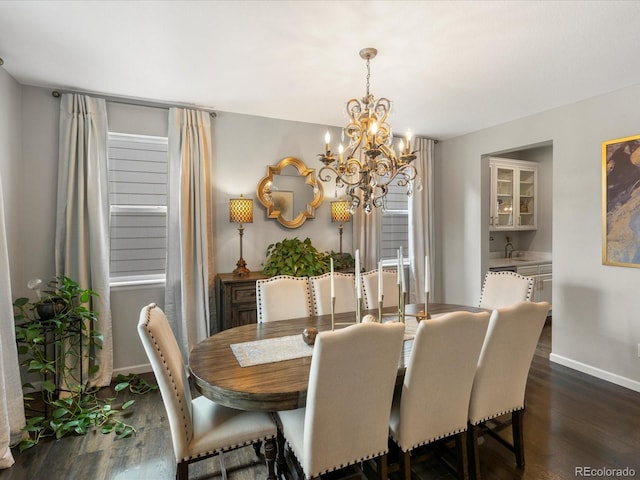 13041 Reata Ridge Dr, Parker, CO 80134 - dining room featuring baseboards, dark wood-style flooring, and a notable chandelier