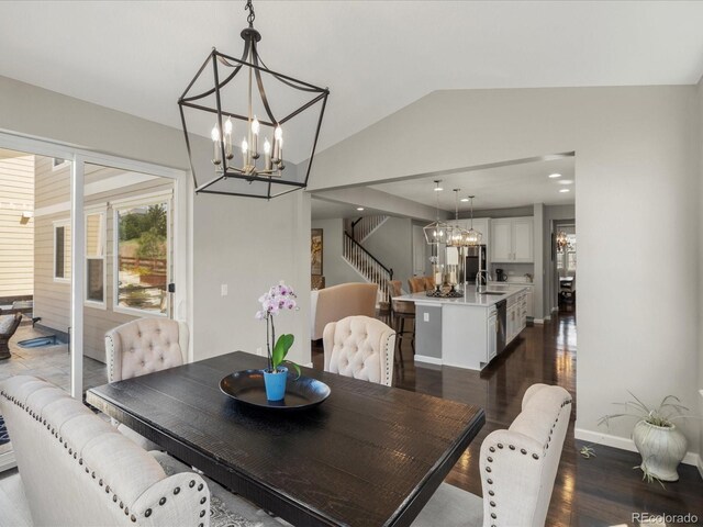 13041 Reata Ridge Dr, Parker, CO 80134 - dining area with an inviting chandelier, stairs, baseboards, dark wood-type flooring, and vaulted ceiling