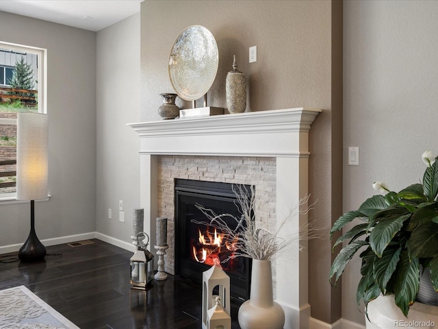 13041 Reata Ridge Dr, Parker, CO 80134 - interior details featuring baseboards, a fireplace, and wood finished floors