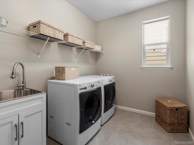 13041 Reata Ridge Dr, Parker, CO 80134 - washroom featuring independent washer and dryer, light tile patterned flooring, cabinet space, a sink, and baseboards