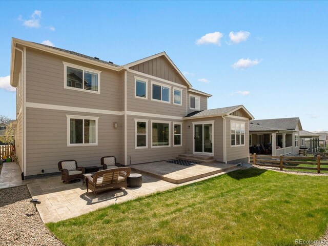 13041 Reata Ridge Dr, Parker, CO 80134 - back of house featuring a fenced backyard, a patio, board and batten siding, and a yard