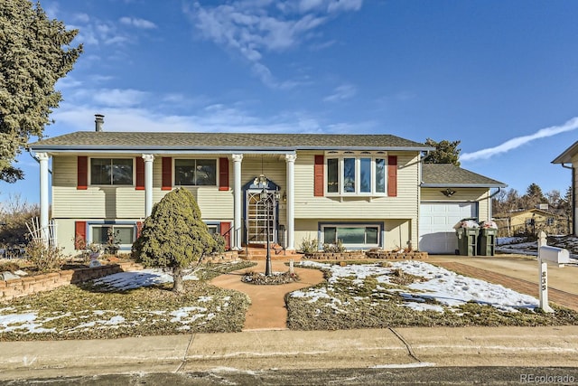 raised ranch featuring a garage