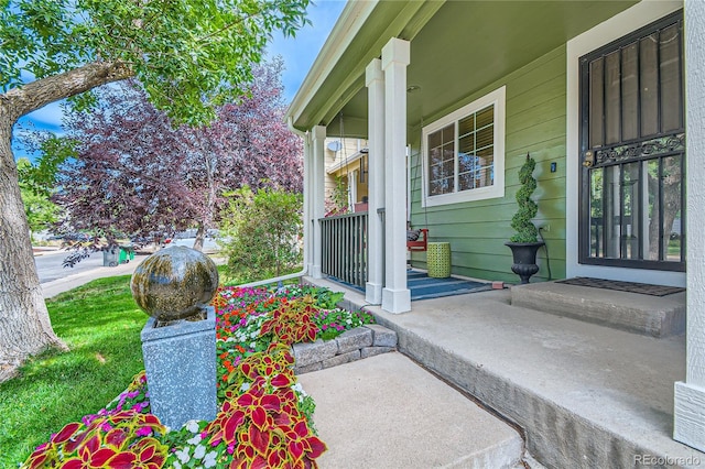 property entrance with covered porch