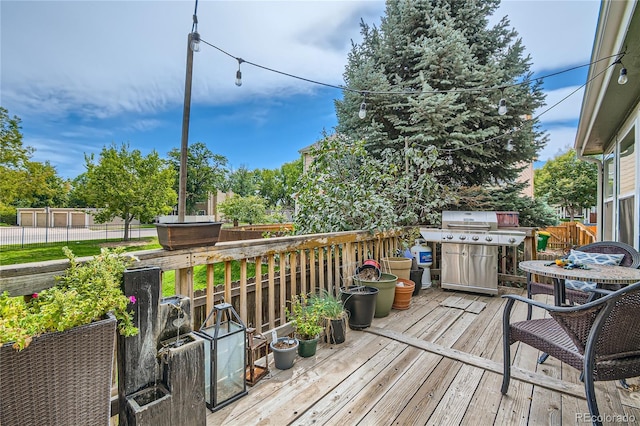 wooden deck with area for grilling