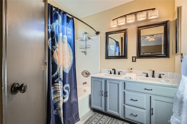 bathroom with tile patterned flooring, shower / bath combination with curtain, and vanity