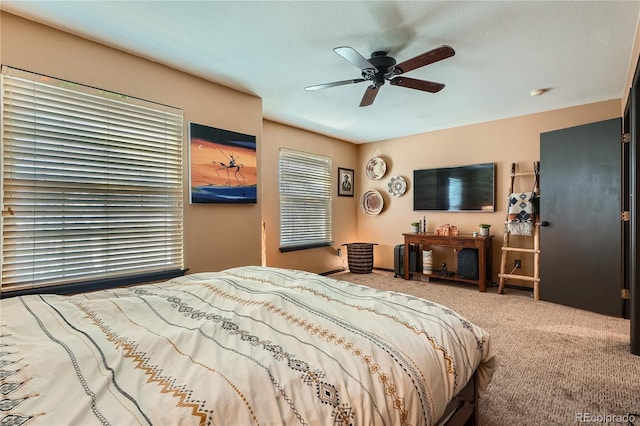 carpeted bedroom with ceiling fan