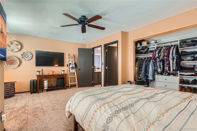 bedroom featuring ceiling fan, a closet, and carpet