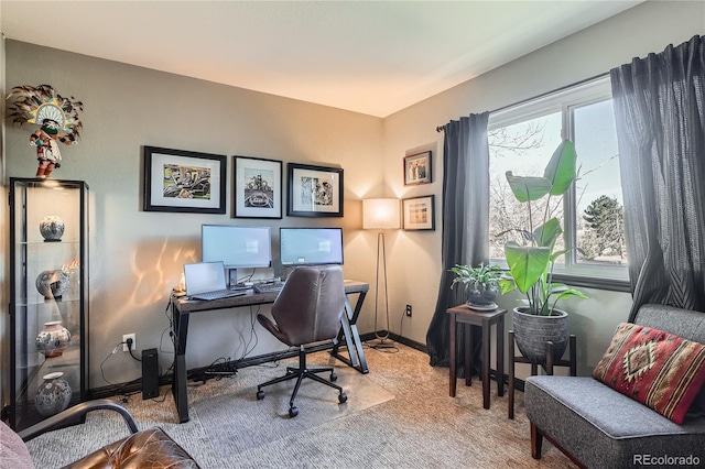 office area featuring light carpet