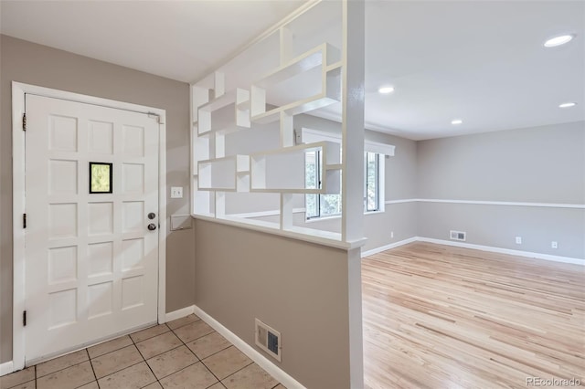 entrance foyer with light tile patterned floors