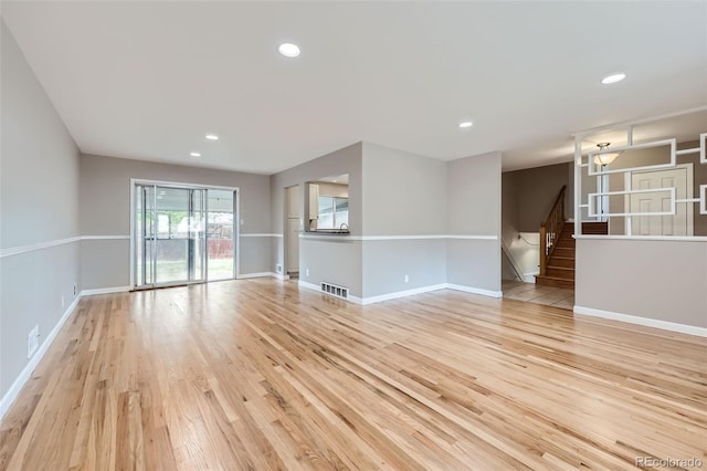 spare room with light hardwood / wood-style flooring