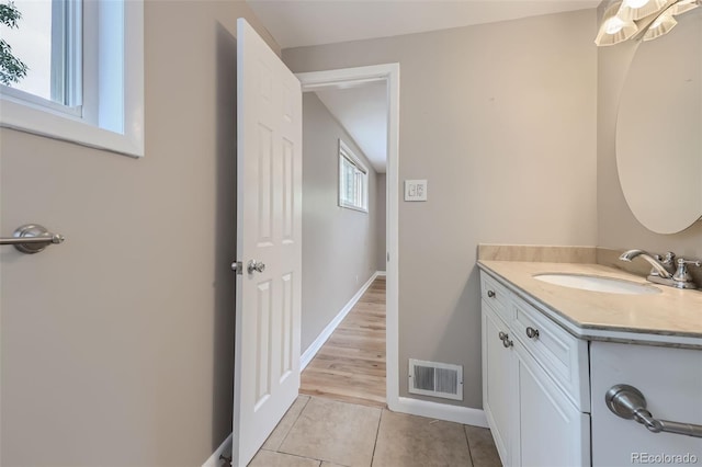 bathroom with tile patterned floors and vanity