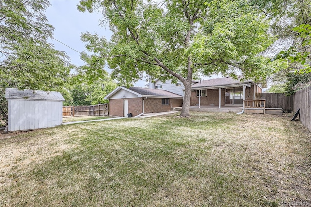 view of yard featuring a shed and a patio