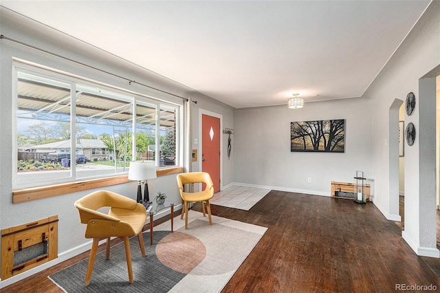 1666 S Bryant St, Denver, CO 80219 - sitting room with wood finished floors, baseboards, and plenty of natural light