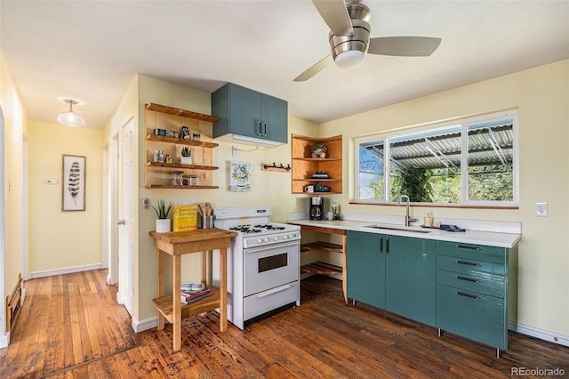 1666 S Bryant St, Denver, CO 80219 - kitchen featuring white gas stove, a sink, open shelves, dark wood-type flooring, and light countertops