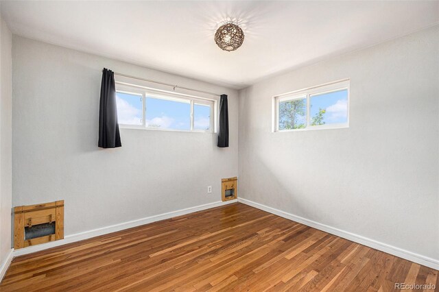 1666 S Bryant St, Denver, CO 80219 - unfurnished room with baseboards and wood finished floors