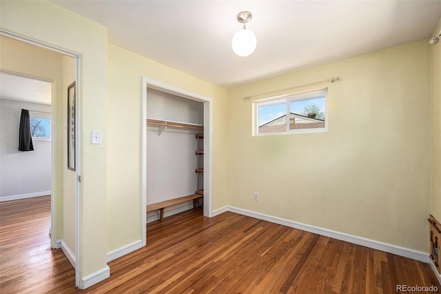1666 S Bryant St, Denver, CO 80219 - unfurnished bedroom featuring wood finished floors, baseboards, and a closet