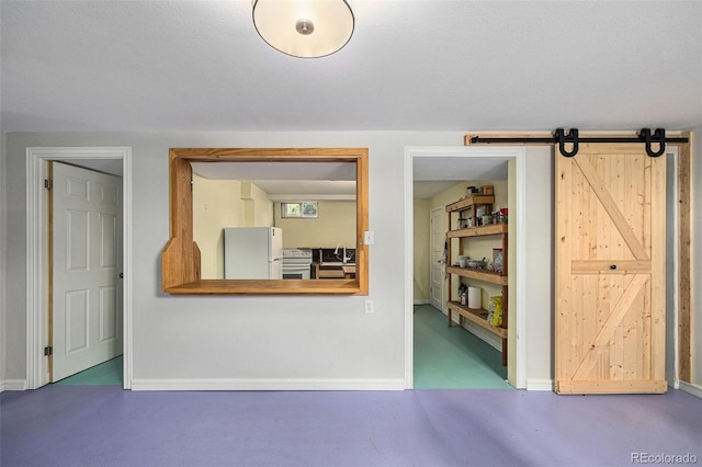 1666 S Bryant St, Denver, CO 80219 - interior space featuring baseboards and a barn door