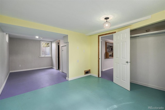 1666 S Bryant St, Denver, CO 80219 - unfurnished bedroom featuring finished concrete flooring, baseboards, and a closet