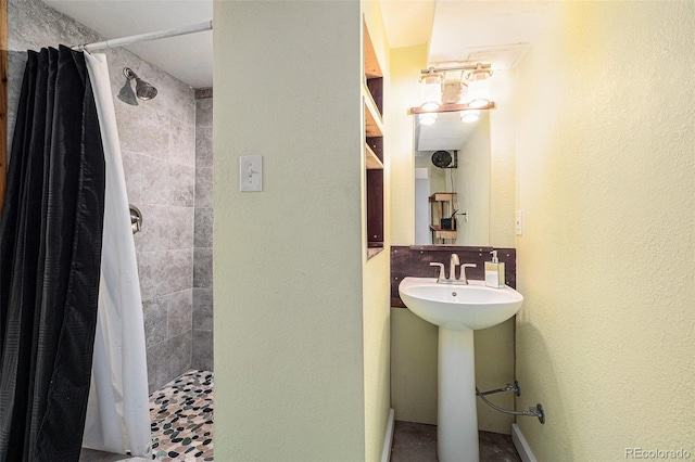 1666 S Bryant St, Denver, CO 80219 - full bathroom featuring a tile shower and a sink