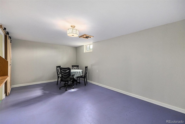 1666 S Bryant St, Denver, CO 80219 - dining room featuring a barn door, concrete floors, and baseboards