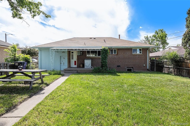 1666 S Bryant St, Denver, CO 80219 - back of house featuring brick siding, a shingled roof, and covered porch