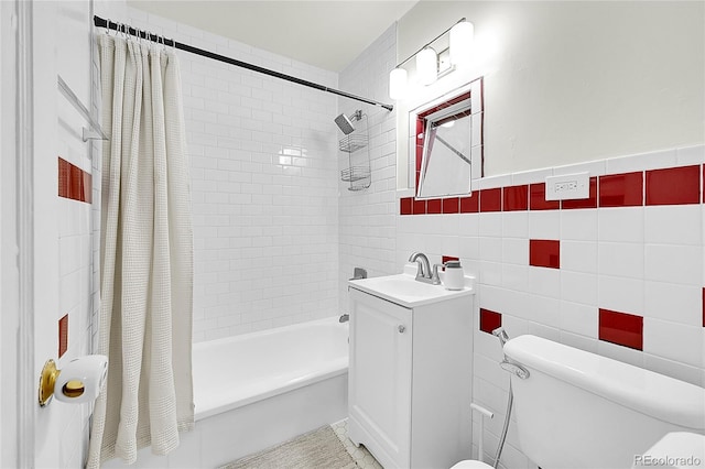 full bathroom featuring tile walls, shower / tub combo with curtain, toilet, and vanity
