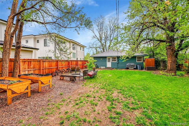 view of yard featuring a garden and entry steps