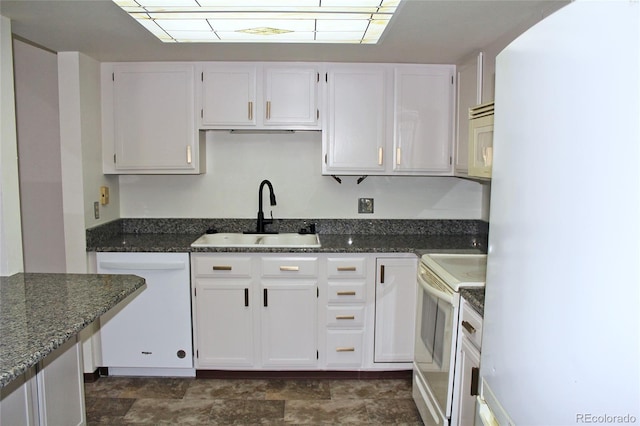 13952 E Marina Dr Unit 304, Aurora, CO 80014 - kitchen featuring white appliances, a sink, white cabinetry, and dark stone counters