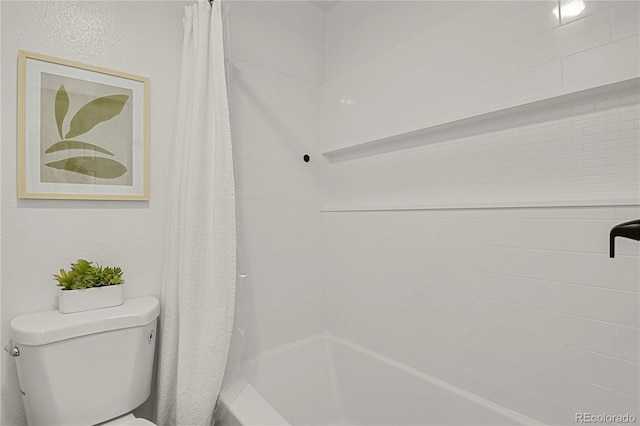 7995 E Mississippi Ave Unit K3, Denver, CO 80247 - bathroom featuring shower / tub combo with curtain and toilet