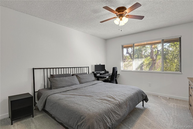 7995 E Mississippi Ave Unit K3, Denver, CO 80247 - bedroom with light carpet, a textured ceiling, and ceiling fan