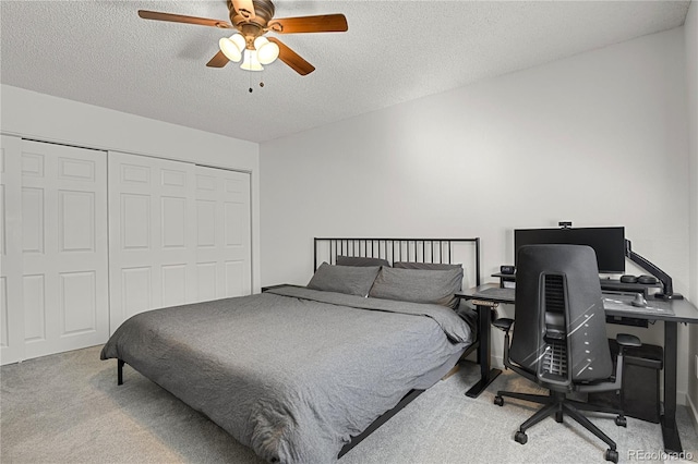 7995 E Mississippi Ave Unit K3, Denver, CO 80247 - carpeted bedroom with a closet, a textured ceiling, a ceiling fan, and a desk