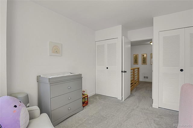 7995 E Mississippi Ave Unit K3, Denver, CO 80247 - carpeted bedroom with multiple closets and baseboards