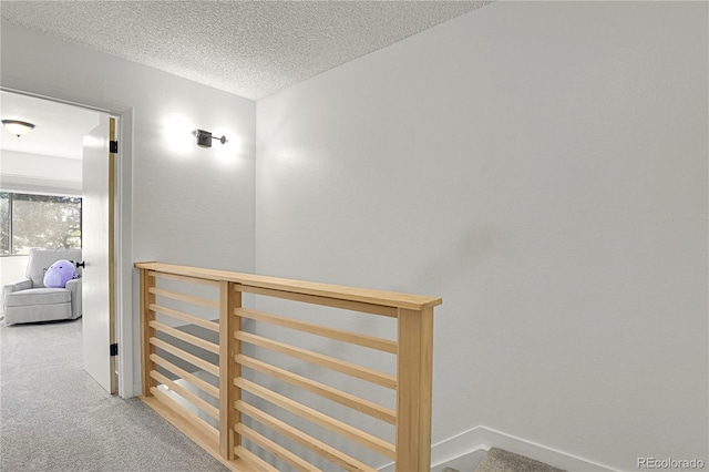 7995 E Mississippi Ave Unit K3, Denver, CO 80247 - corridor featuring carpet flooring and a textured ceiling