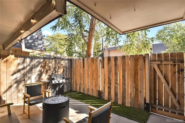 7995 E Mississippi Ave Unit K3, Denver, CO 80247 - view of patio / terrace featuring a gate, an outdoor fire pit, and area for grilling