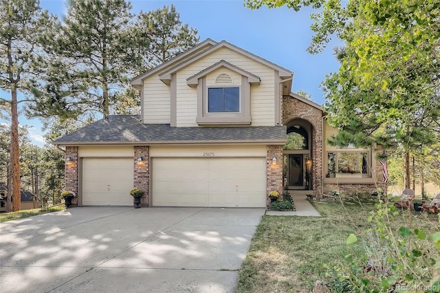 view of front of house with a garage, concrete driveway, brick siding, and roof with shingles